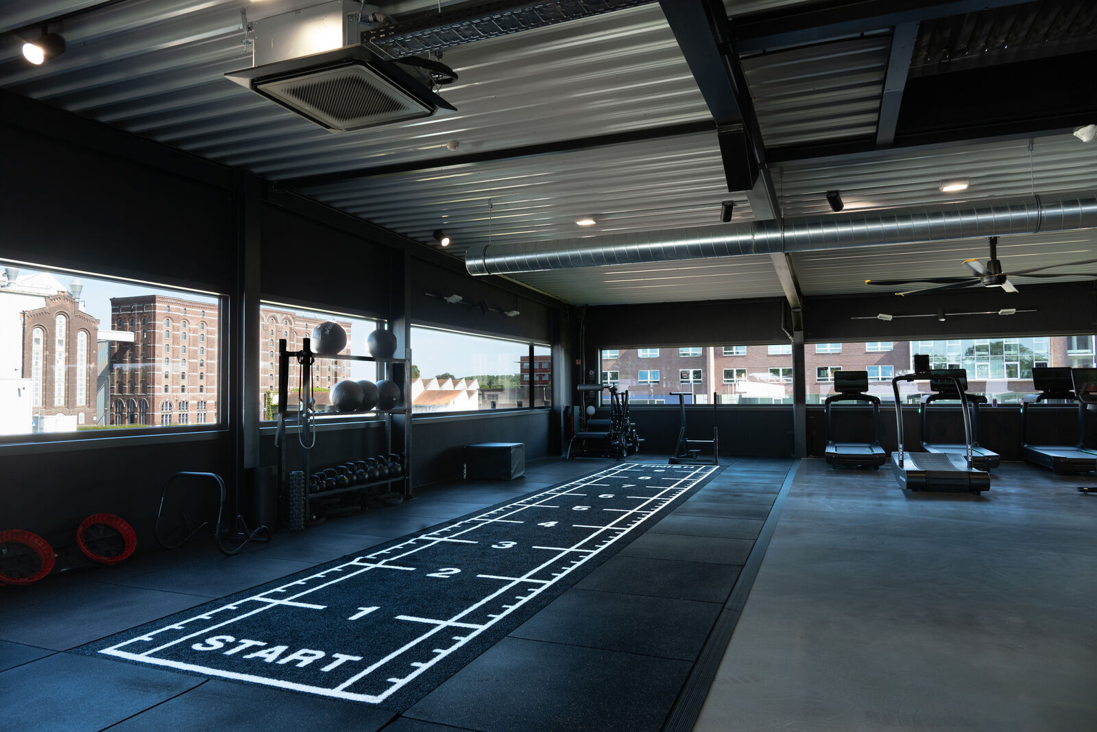 The cardio machines next to the track