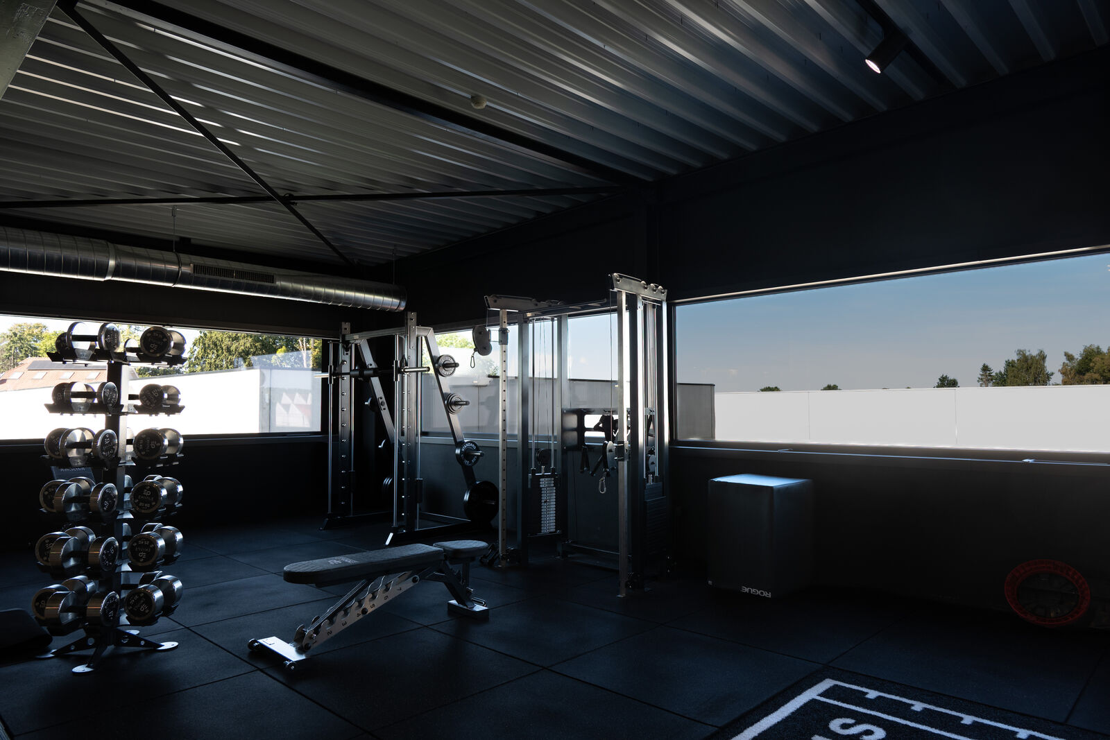 Medicine balls, cable station and open floor