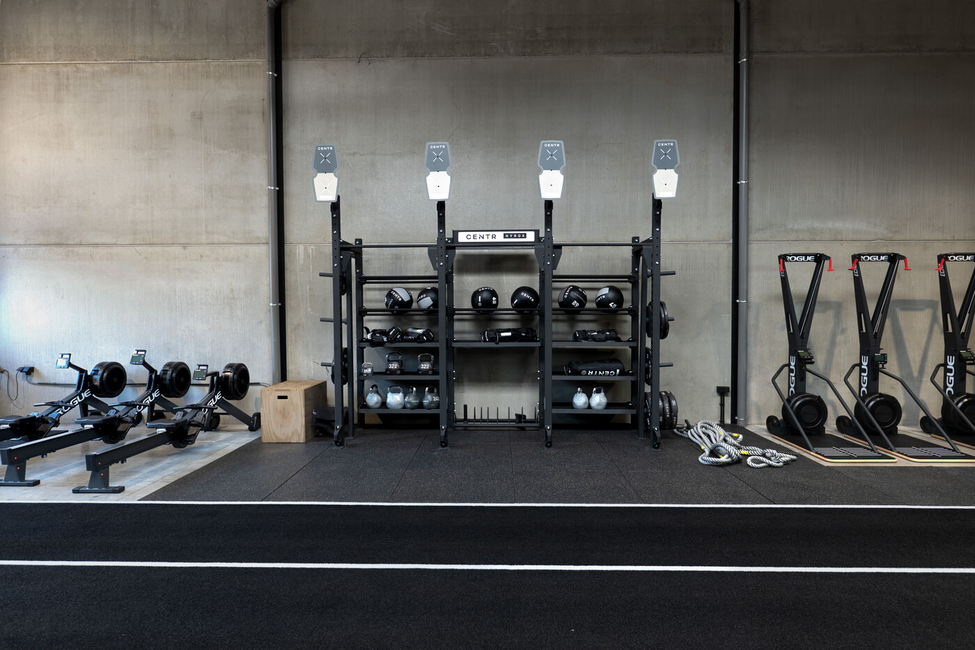 Rack with wall balls, kettlebells and sandbags